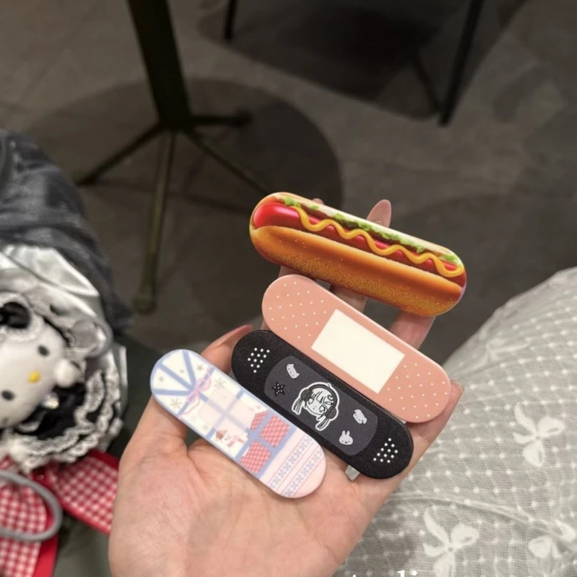 Bandage - 可愛い包帯型ホットドッグプッシュプル式スマホグリップホルダー粘着スライド式クリエイティブスマホスタンド落下防止フィンガーストラップ携帯電話用